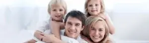 Family with mom dad and kids smiling with healthy teeth after regular dental visits at Signature Smiles Dental Group in Milpitas CA