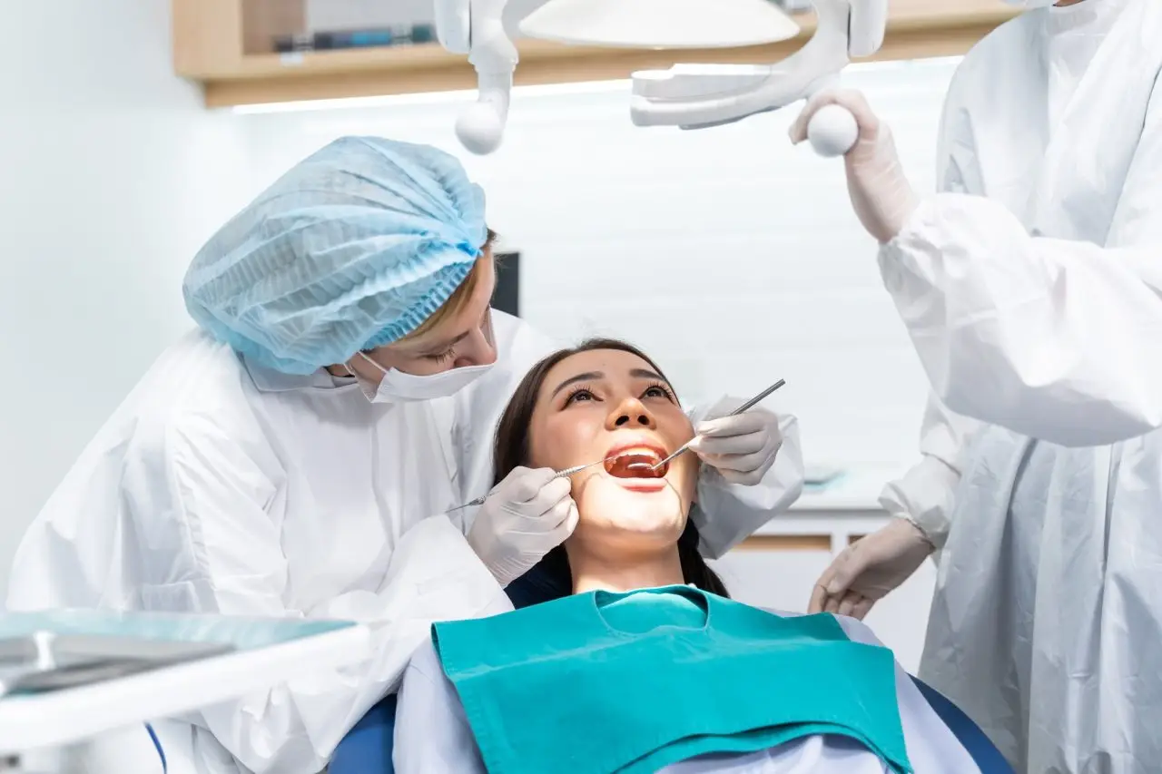 Dentist performing a dental exam on a patient at Signature Smiles Dental Group in Milpitas, CA