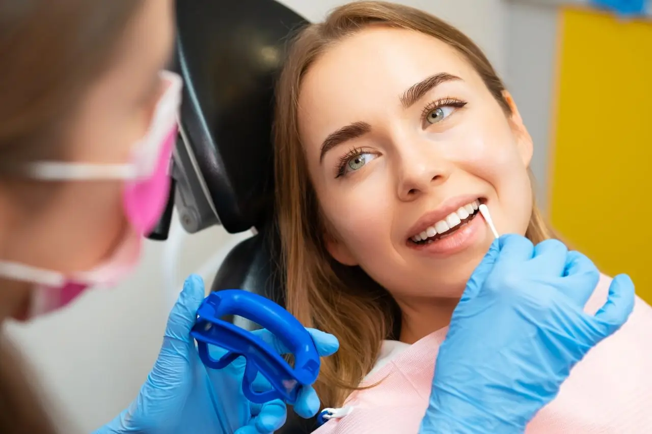 Dentist checking gum health for gingivitis symptoms at Signature Smiles Dental Group in Milpitas, CA