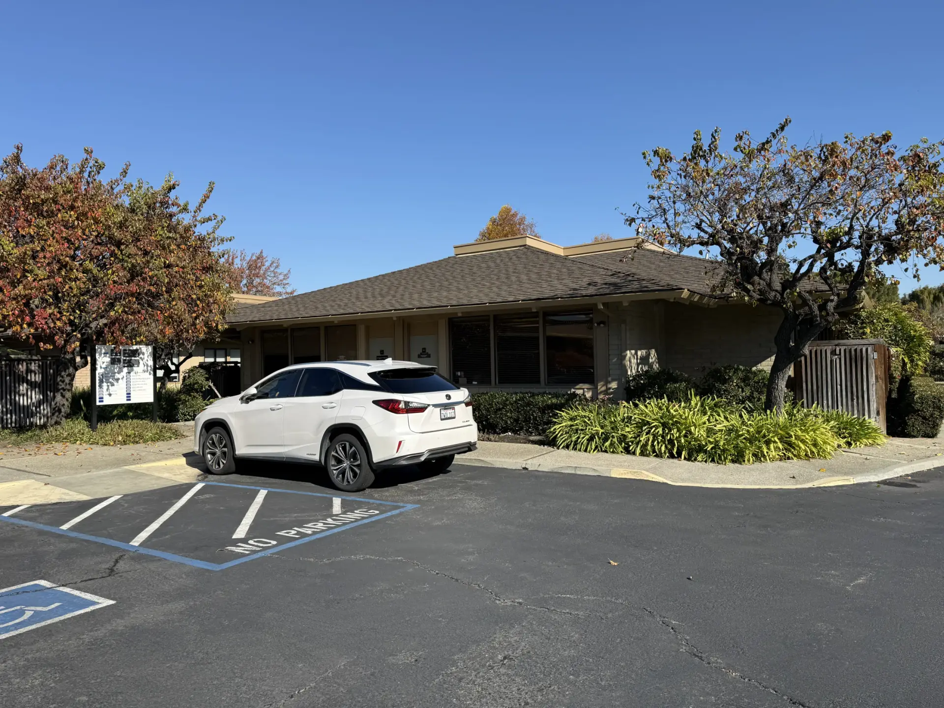 View of the Signature Smiles dental office building from the free parking lot in Milpitas, California